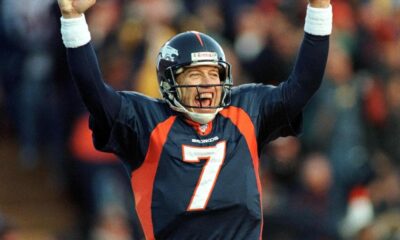 Denver Broncos quarterback John Elway celebrates a